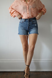 Girl wearing denim shorts#color_tru