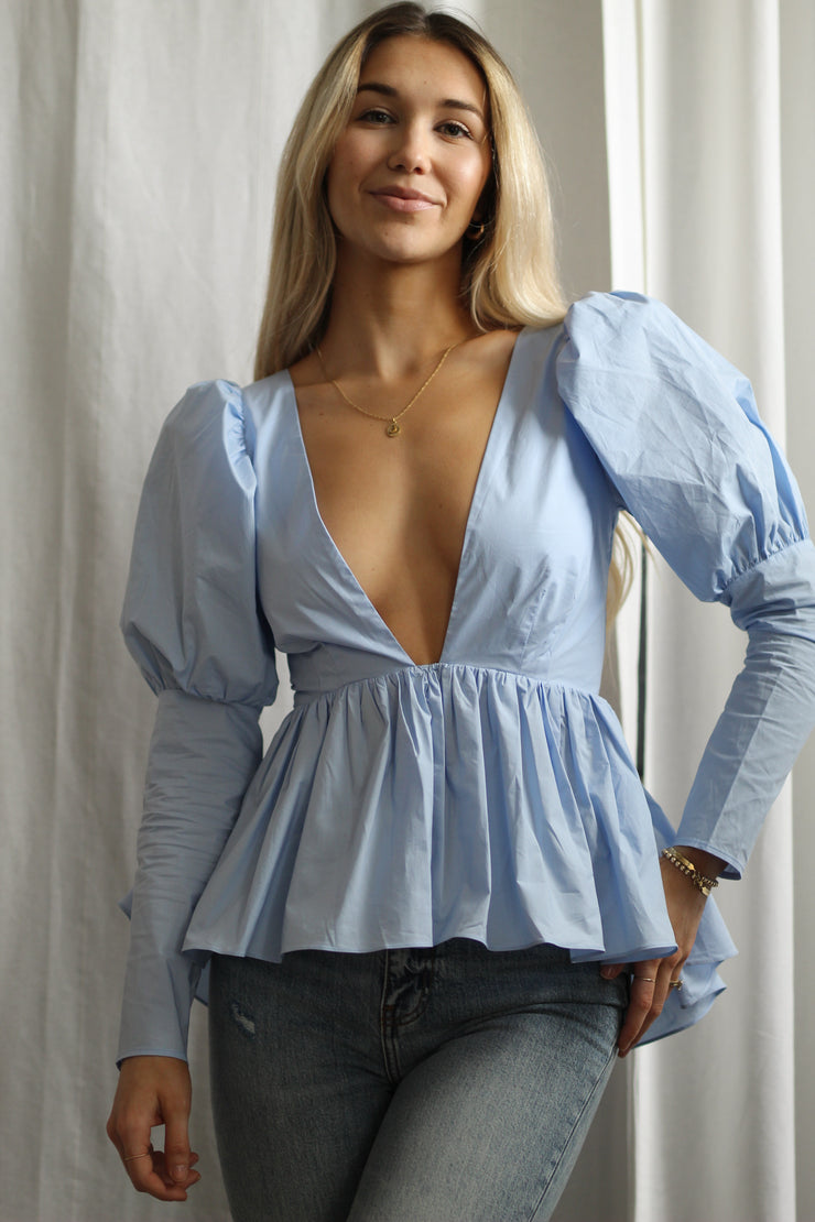 Girl wearing a blue blouse