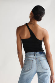 A girl wearing a black one shoulder top