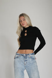 A Girl Wearing a long sleeve black top#color_black
