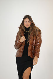 Girl wearing a brown jacket#color_coffee
