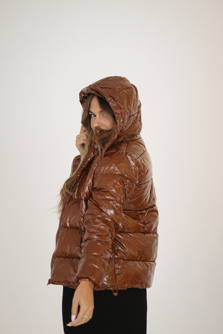 Girl wearing a brown jacket