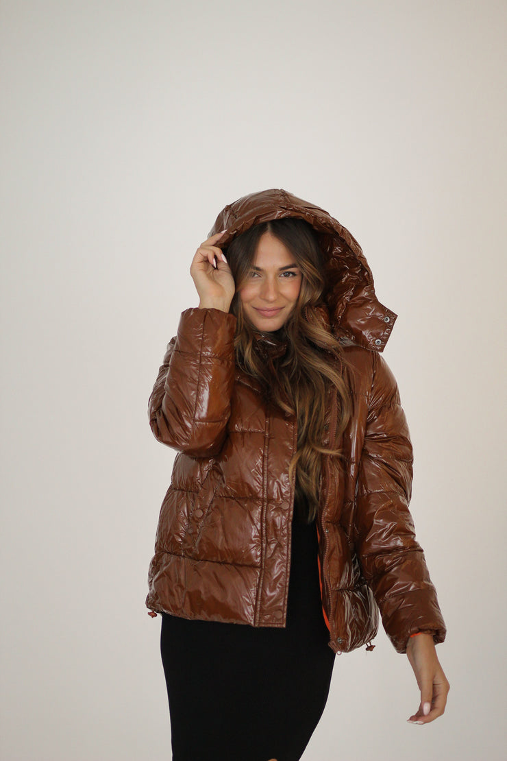 Girl wearing a brown jacket