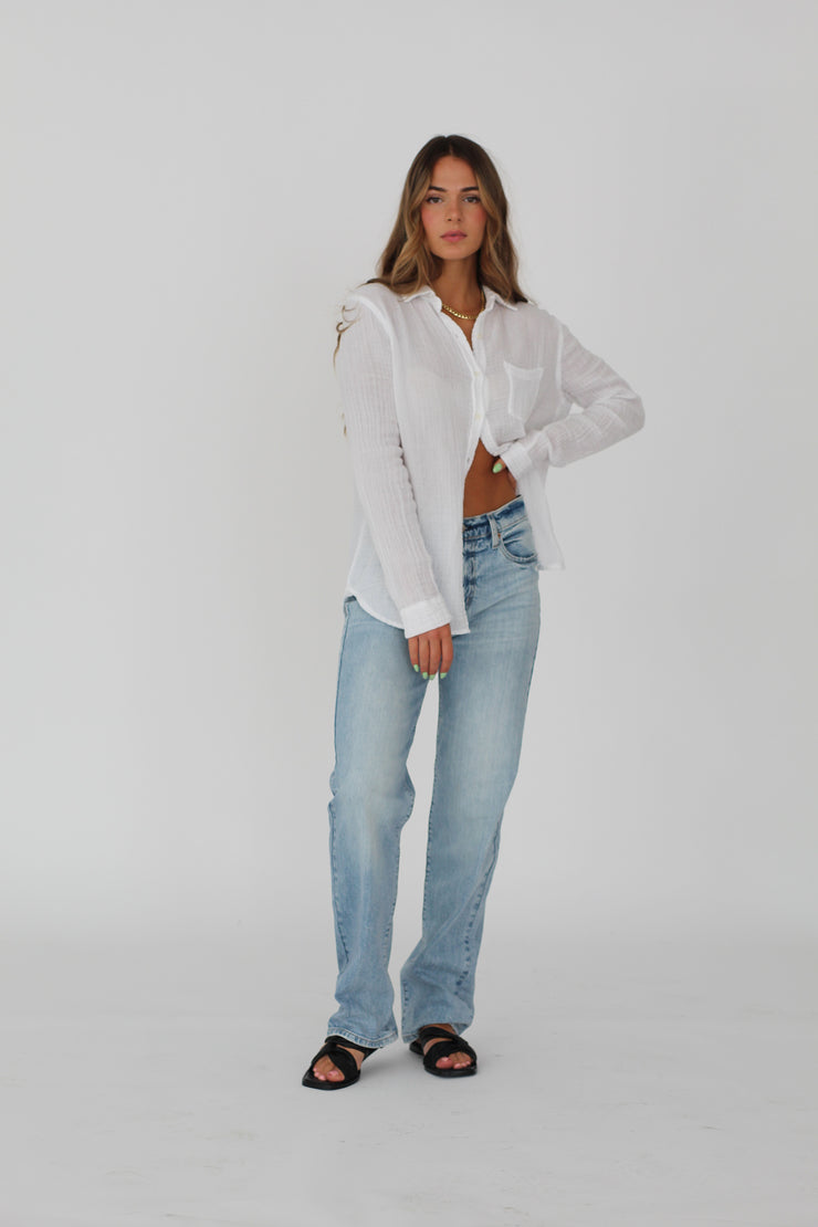 Girl wearing white button up