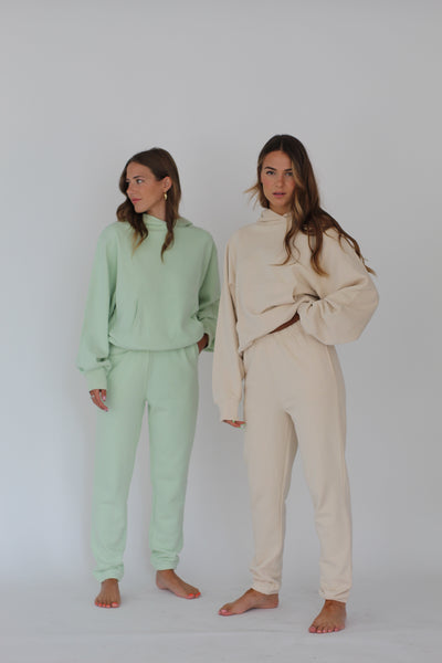 Two Girls Wearing a Mint and French Vanilla Hoodie#color_french-vanilla